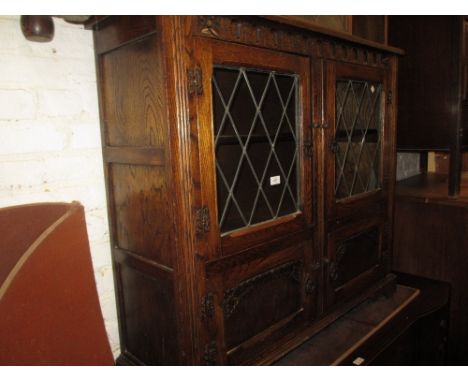 Reproduction oak side cabinet with leaded glass doors, a 1930's oak bureau and a 1930's oval oak gate leg table on barley twi