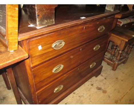 Edwardian mahogany straight front chest of three long drawers with oval brass handles on bracket supports