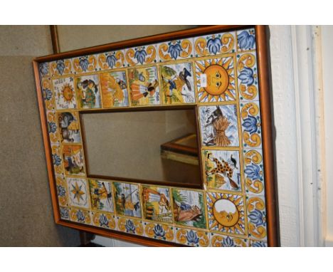 Spanish wall mirror with tiled surround depicting months of the year