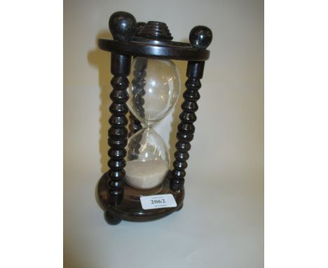19th Century coromandel sand timer with bobbin turned supports and ball feet, 8.5ins high
