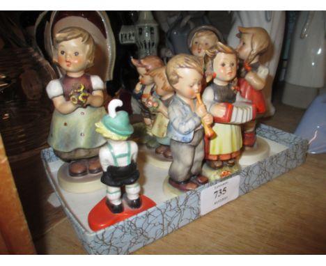 Quantity of various Hummel figures of children