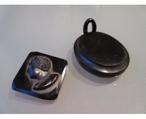 19th Century oval jet locket together with a jet portrait brooch