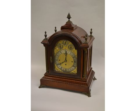 Early 20th Century mahogany bracket clock, the pagoda case with pineapple finial, Corinthian columns and claw feet, the brass