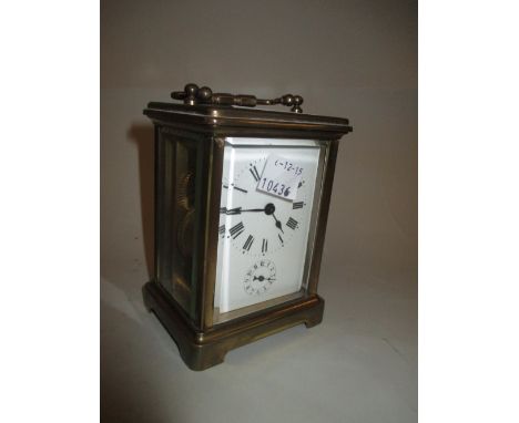 Brass cased carriage clock with enamel dial, Roman numerals and alarm dial with single train movement