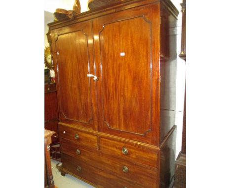 George III mahogany linen press, the moulded cornice above two panelled doors, the base with two short and two long drawers r