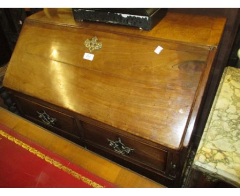 George III mahogany bureau having fall front enclosing a fitted interior above two short and two long drawers with brass hand