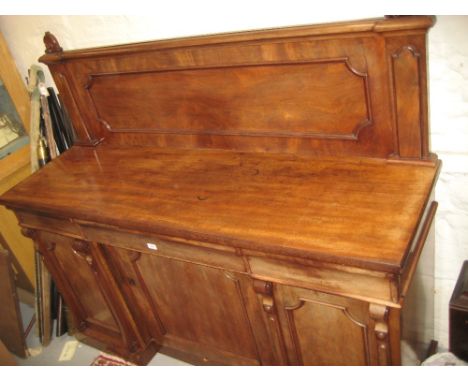 Victorian mahogany chiffonier, the moulded back above three drawers, the inverted breakfront base with three panel doors, mou