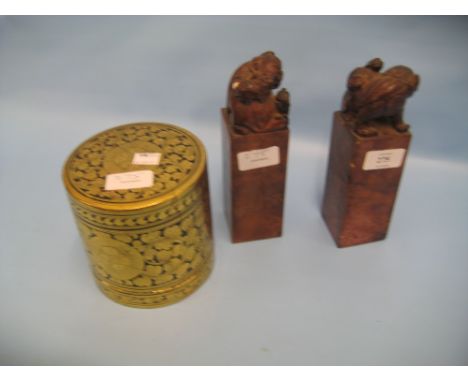 Pair of Chinese carved soapstone scroll weights together with a cylindrical gilt decorated lacquer box and cover and a lacque