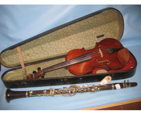 Late 19th or early 20th Century violin with one piece back bearing a label after Stradivarius in an ebonised wooden case toge