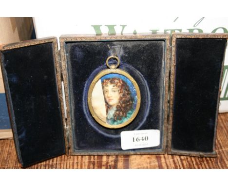 Watercolour portrait miniature on ivory of a 17th Century boy (a/f) in a gilt metal mount and leather case