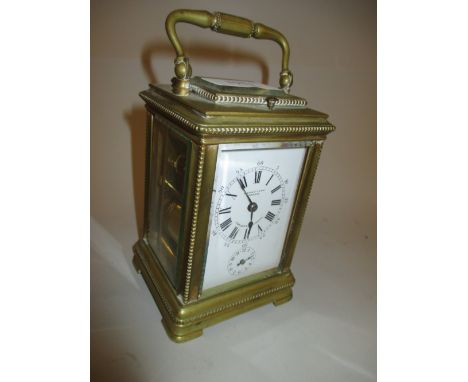 Swiss brass carriage clock, the bead moulded case enclosing an enamel dial with Arabic and Roman numerals, signed Henry Capt,