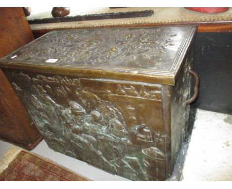 19th Century bronzed metal log box, the hinged cover above a relief work front panel depicting figures in an interior