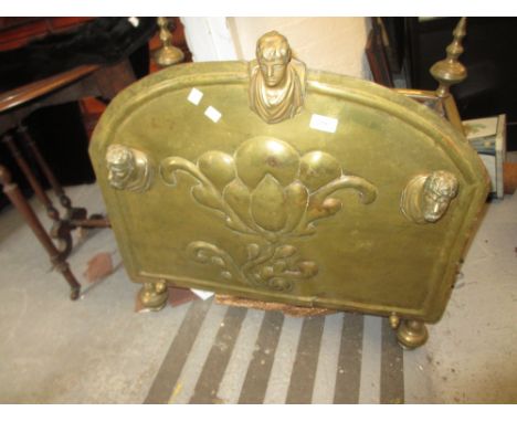 Unusual antique embossed brass log bin with knopped finials, the front panel decorated with a flower head in relief and appli