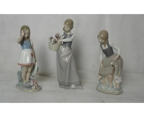 A Lladro girl with geese; together with a girl with lilies and three figures of geese