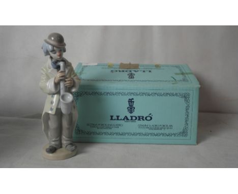 A boxed Lladro figure of a clown playing the saxophone 5471
