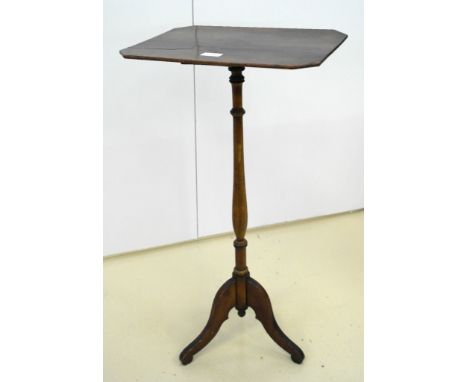 A 19th century mahogany wine table on tripod feet