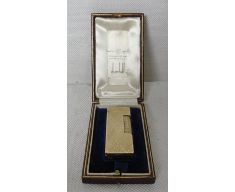An early 1950s cased 9ct Dunhill lighter
