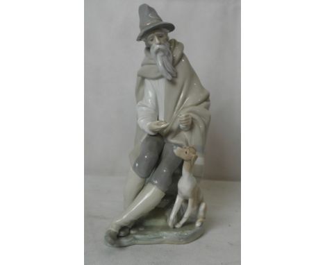 A large Lladro man and dog