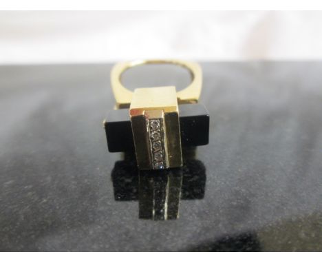 A 1960s abstract 14k diamond and onyx dress ring