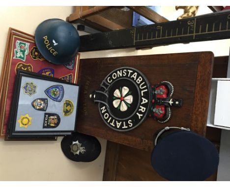 A Thrapston constabulary shield & prisoner's measurement stick; together with a prison officer's ceremonial hat, police tin h