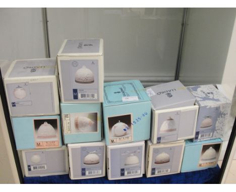 Twelve boxed Lladro bells
