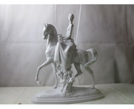 A Lladro lady sitting side-saddle