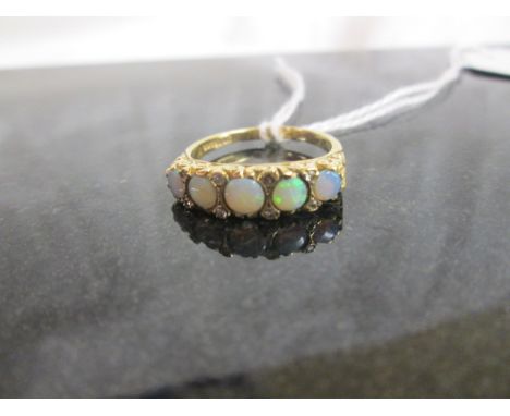 An opal and diamond 5 stone ring