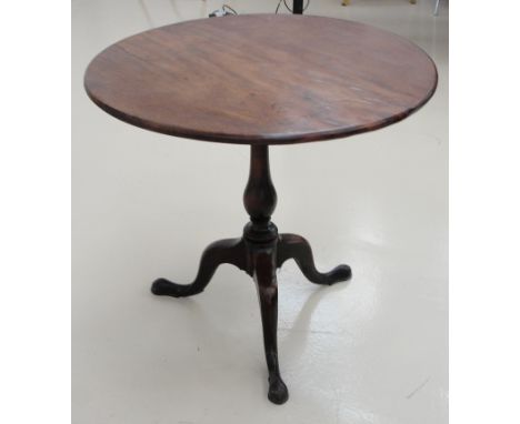 A 19th century mahogany tilt top table on tripod feet