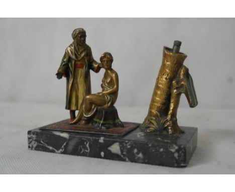 A painted spelter 1930s Tiptronic lighter; together with an Oriental lady
