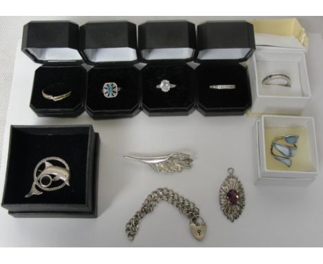A quantity of silver jewellery: rings, pendants, brooch; together with a 9ct diamond ring