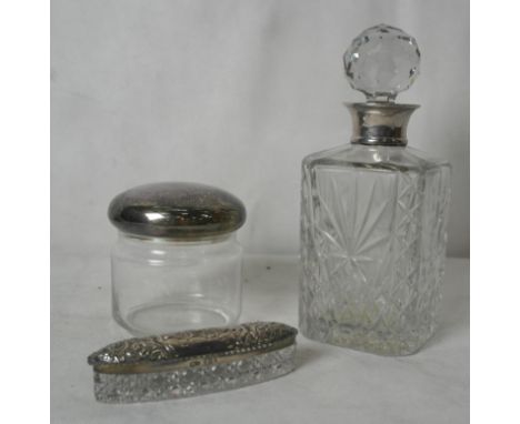 A HM silver topped decanter; together with two trinket boxes with silver lids