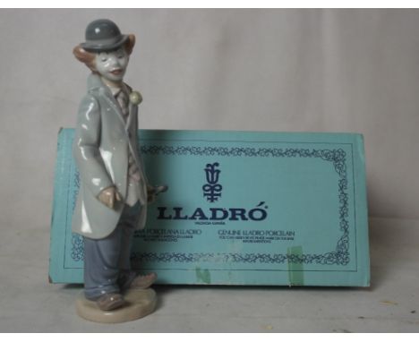 A boxed Lladro figure of a clown holding a violin 5472