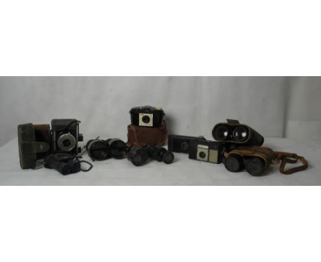 A box of vintage cameras and binoculars to inc a Hughes & Son The Liverpool Huson example