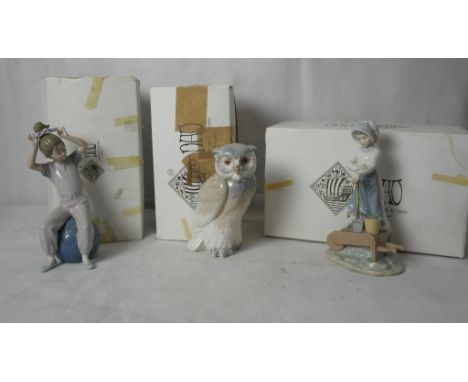 Three boxed Nao figures to inc an owl and girl gardening