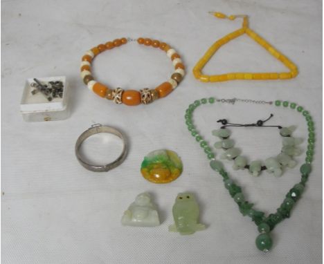 A quantity of amber and jade jewellery