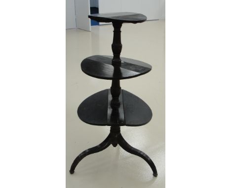 A 19th century mahogany butler's table on swept tripod feet