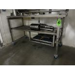 SS 3-level mobile rack on lockable casters w/ grill parts shelving, no contents.