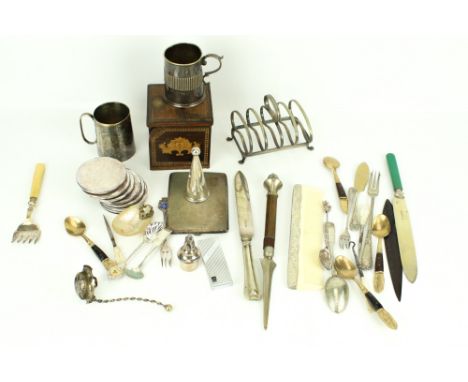 An assortment of silverplated items. Including a cigarette case, cutlery and cups, etc.