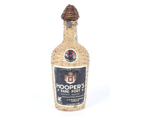 A vintage bottle of Hooper's Rare Port. In wicker case, no volume shown but weighing 1.39kg. 