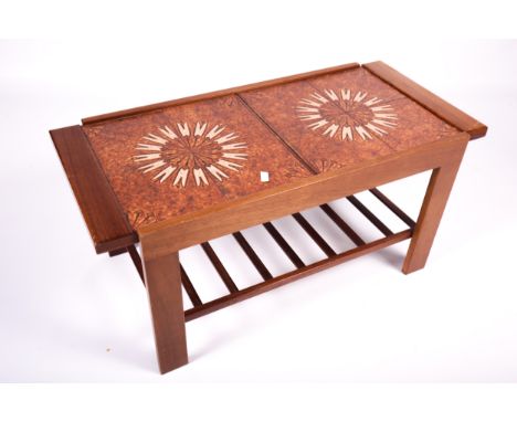 Vintage / Retro : A mid-century extending tile top coffee table. With undertier shelf, L129cm x W 44cm x H44.5cm (extended) 
