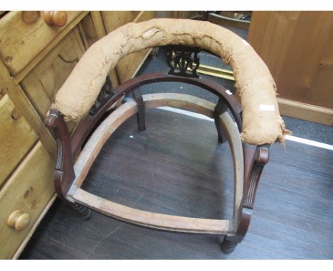 A late Victorian mahogany tub chair frame and turned legs having a mahogany frame firescreen