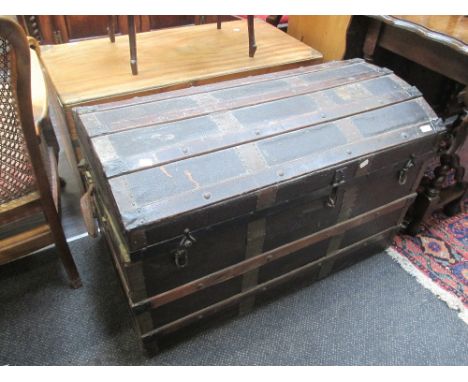 An late Victorian/Edwardian wood board dome top cabin trunk of treasure chest style