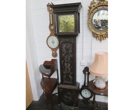 A late 18th century oak longcase clock having square pillar hood containing brass dial and 30 hour movement by Burton, Kendal
