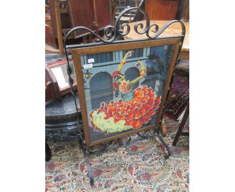 A wrought iron frame firescreen by the Benny Beg Smithy having inset Pemberton tapestrey