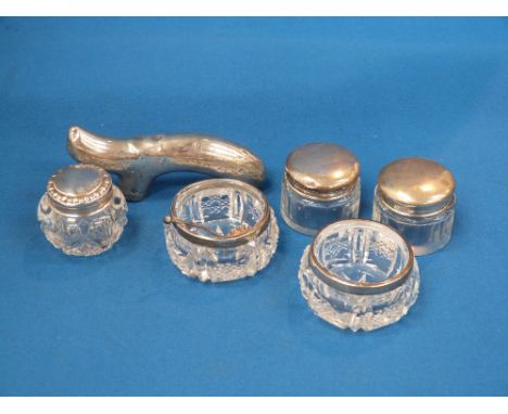 Three small glass dressing table pots having HM silver lids, two glass salts having HM silver collars with one HM silver fril