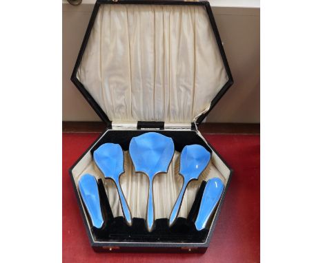 A cased five piece dressing table brush and mirror set having blue guilloche enamel decoration, Birmingham 1933, Daniel Manuf