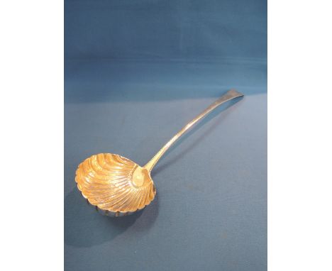 A Georgian silver punch ladle having scalloped bowl and bright cut decoration to handle, London 1777, makers mark worn but po