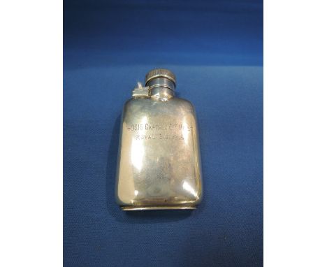A small silver hip flask of plain form having bayonet hinged lid and inscribed:  140316 Captain G F Hirst, Royal Signals, Bir