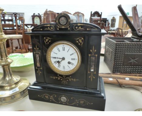 A late Victorian black marble/slate mantel clock having incised gilt heightened and marble decoration with striking movement 