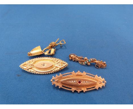 Three  early 20th Century 9ct gold brooches having ruby, seed pearl and diamond decoration, and a yellow metal South African 
